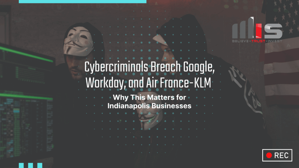 Two people wearing Guy Fawkes hacker masks sit in a dark room with multiple computer screens glowing green, symbolizing cybercrime. Text overlay reads: “Cybercriminals Breach Google, Workday, and Air France-KLM — Why This Matters for Indianapolis Businesses. The MSI logo with the tagline “Believe. Trust. Invest.” is in the top-right corner.