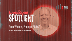 Employee Spotlight graphic featuring Brett Walters, Principal/CISSP, with a sepia-toned portrait on a red curtain background. Text reads ‘Employee Spotlight – Brett Walters, Principal/CISSP – From Dial-Up to Co-Owner,’ alongside the MIS company logo with the tagline ‘Believe • Trust • Invest.