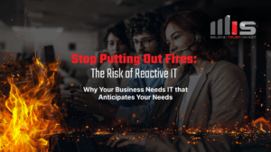 A team of professionals works at computers in a dark office, with flames and embers rising in the foreground. The image is overlaid with bold text reading “Stop Putting Out Fires: The Risk of Reactive IT.”